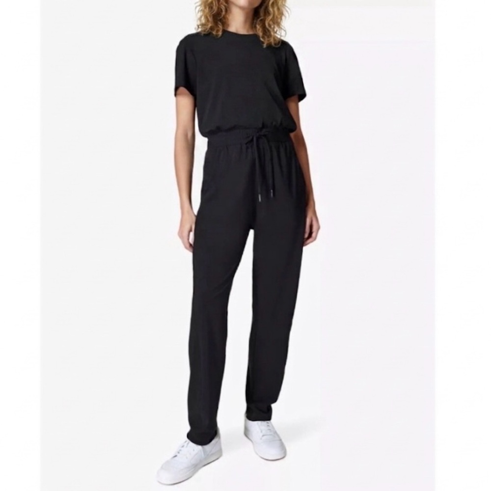Sweaty Betty - women’s Explorer Short sleeve stretch Woven black Jumpsuit SZ M